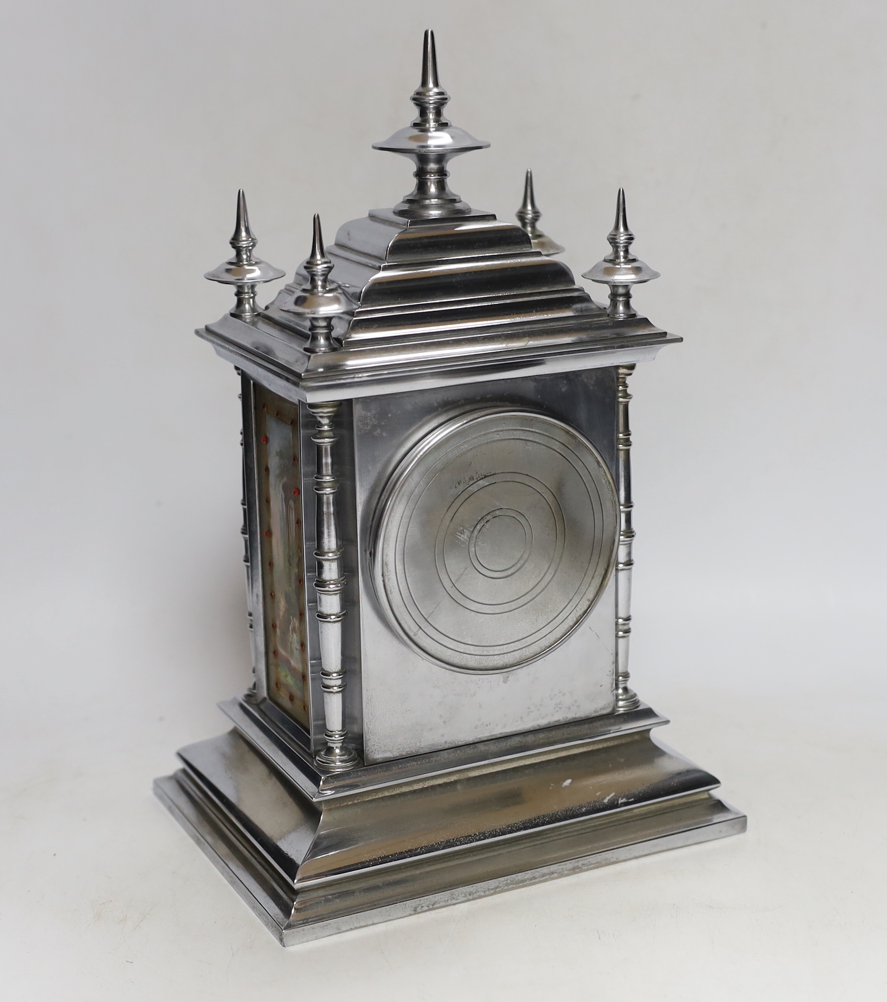 A French chrome plated mantel clock, with jewelled porcelain inset panels 32cm